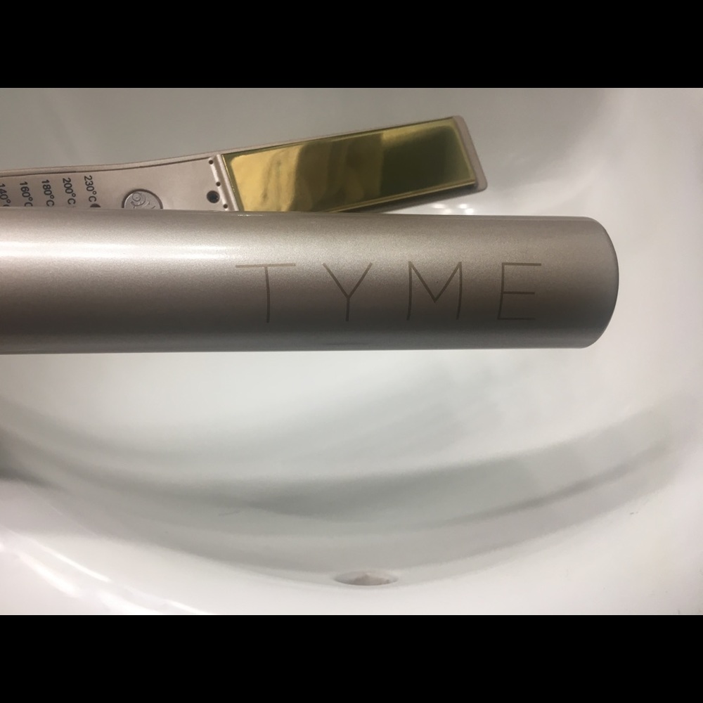 TYME flat / curling iron. Adjustable heat.